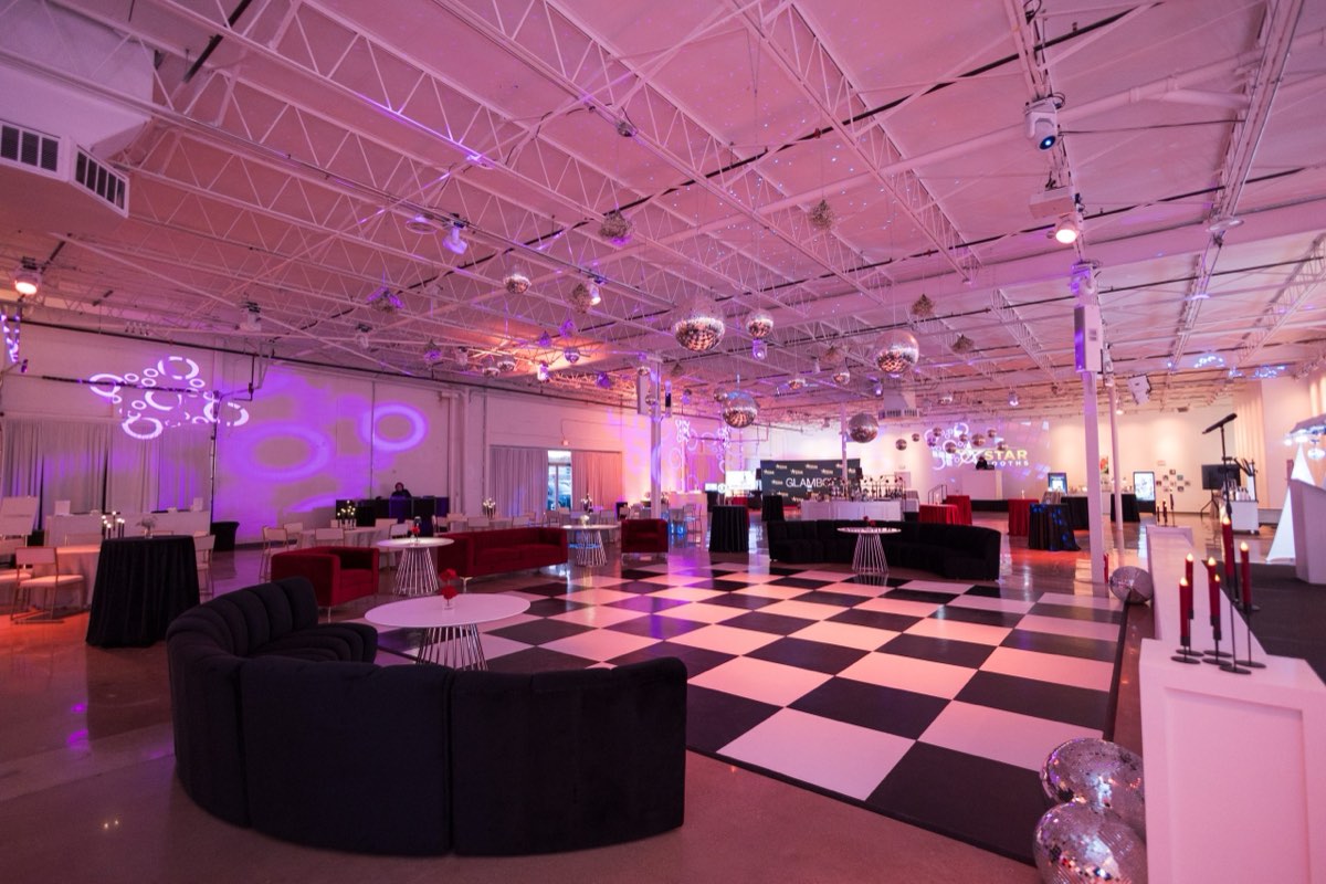 Party setup with disco balls and a checkered dance floor at Astoria Event Venue